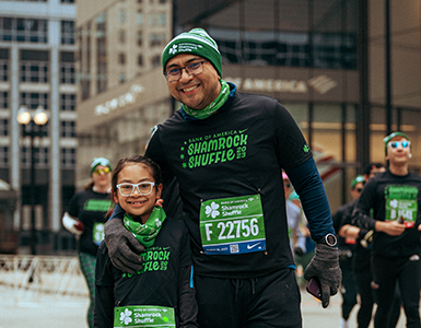 Man and child excited after finishing the Shamrock Shuffle