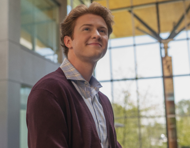Man smiling and looking off into the distance