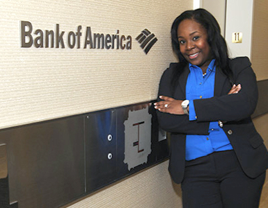 Woman in front of Bank of America sign