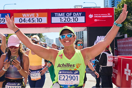 Runner crossing Chicago marathon finish line