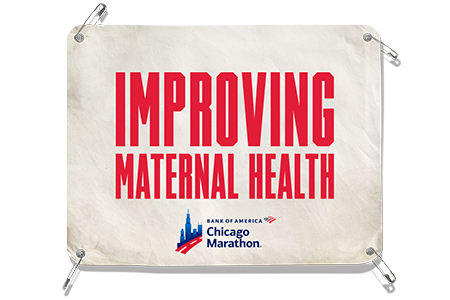 Bib reading “IMPROVING MATERNAL HEALTH”