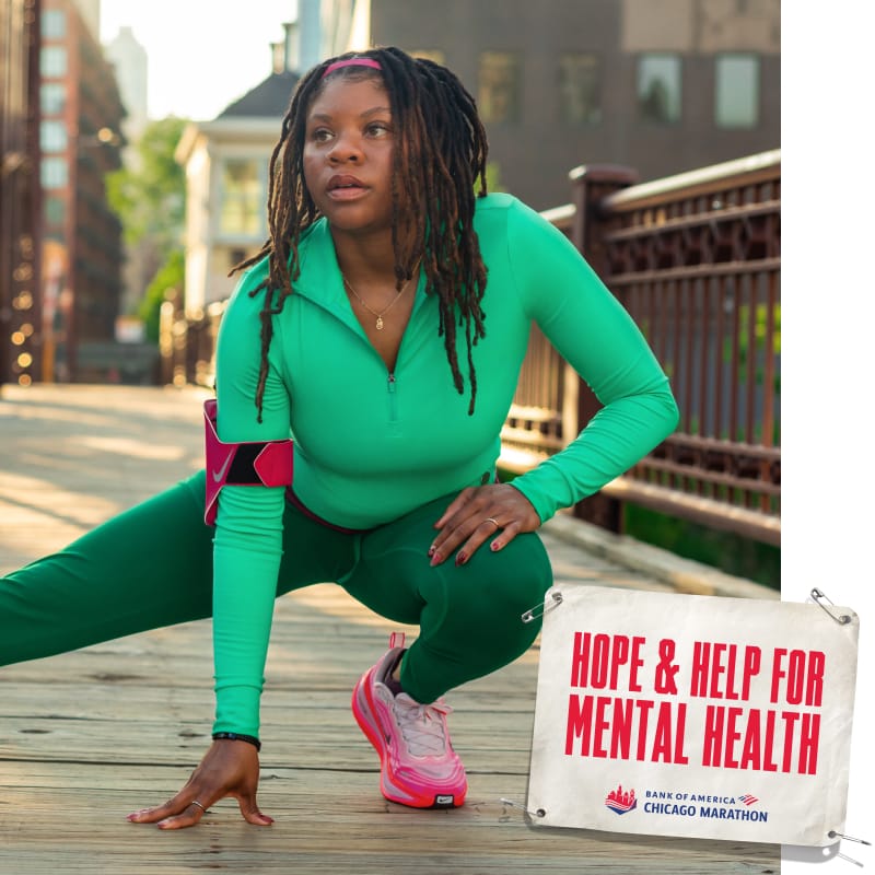 Bria stretching with an image of a bib that reads “HOPE AND HELP FOR MENTAL HEALTH”