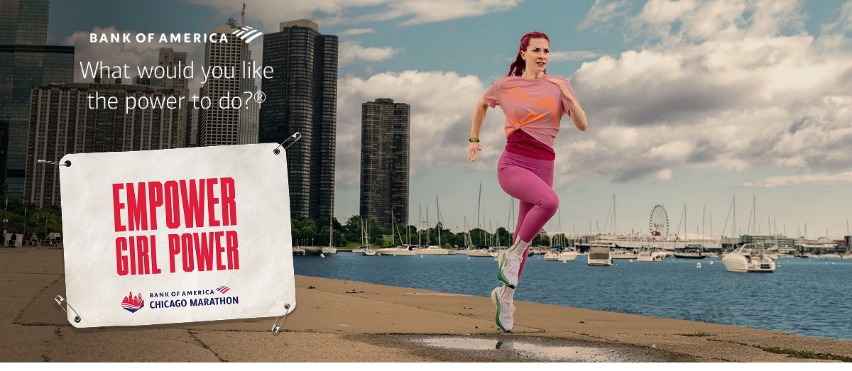 Allie running with a marathon bib saying empower girl power