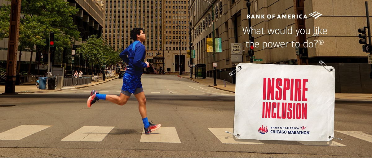 Daniel M. running with a marathon bib saying inspire inclusion