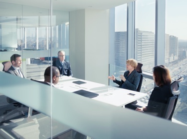 executives meeting in a conference room 