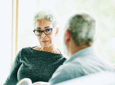 man and woman discussing finances 