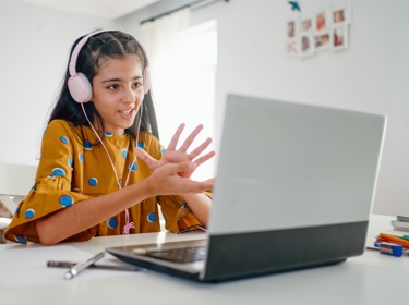 Child with headphones talking