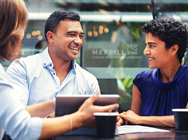 Man and two woman smiling outside