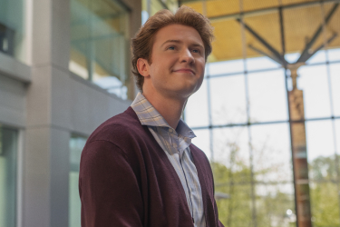 Young male Bank of America employee smiling