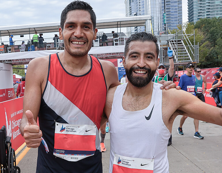 Two men excited after running the Chicago Marathon