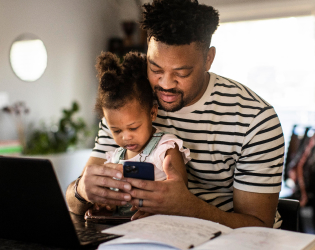 Man and child at desk