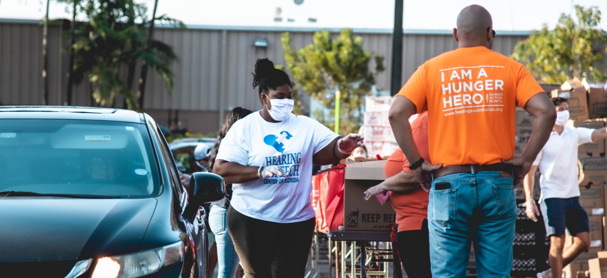 Volunteers distributing care packages to people