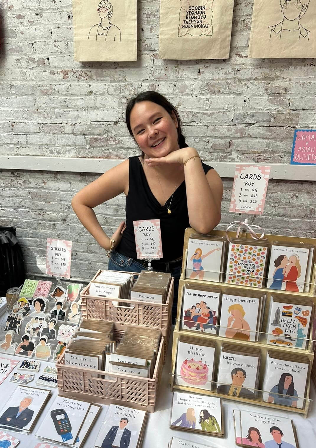 Sarah Mar, small business owner of Smar Art, displaying her products