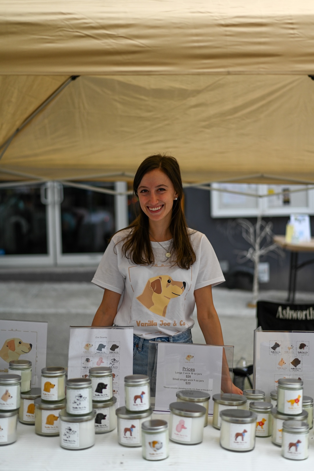Rachel Heim, founder and small business owner of Vanilla Joe & Co, displaying her candles 
