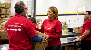 Bank of America volunteers helping each other and smiling