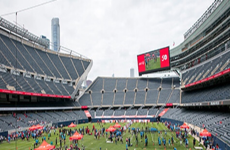 Athletes warm up on Soldier Field