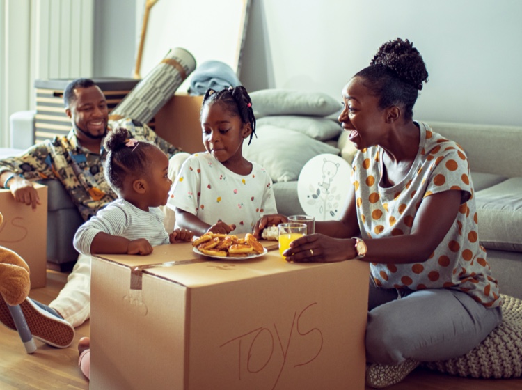 Family sitting around table eating breakfast