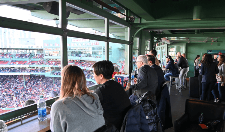 Spectators at Fenway park watching a baseball game
