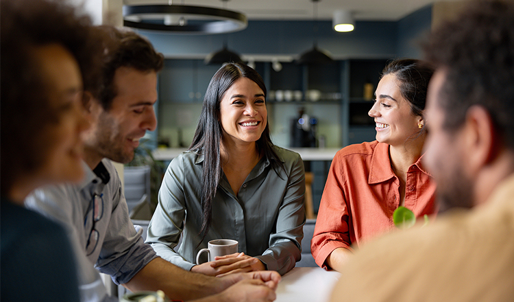 Woman smiling at a group of people