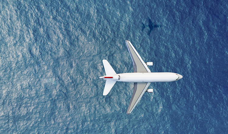 A picture containing plane, water, outdoor.