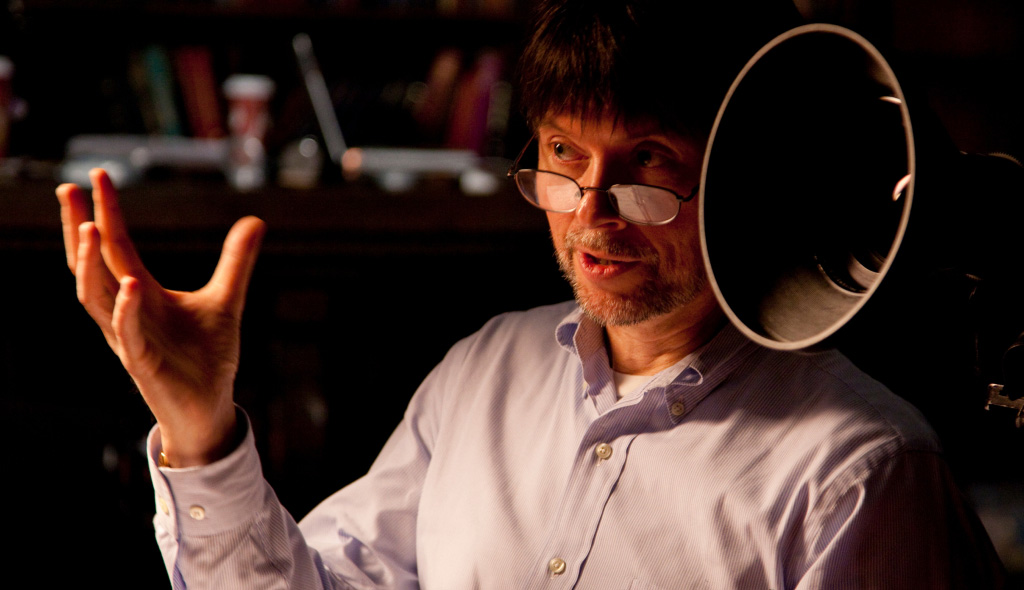 Ken Burns speaking next to film equipment