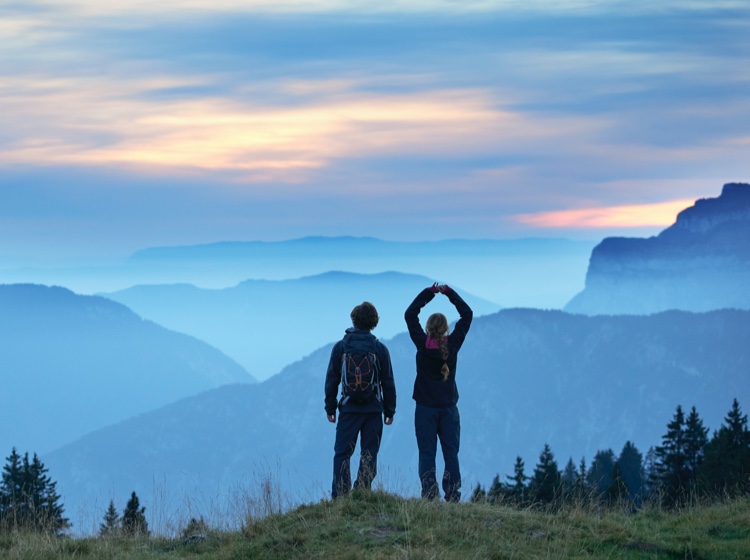 two people on a background of mountains