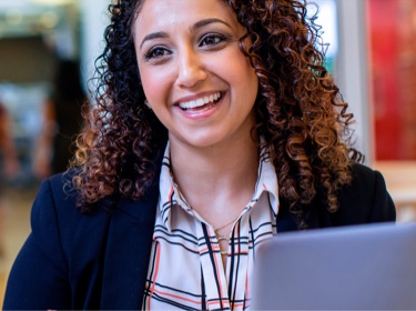 Woman smiling in a meeting