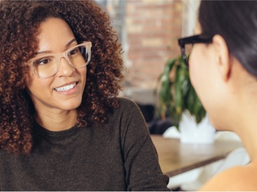 Woman talking to couple