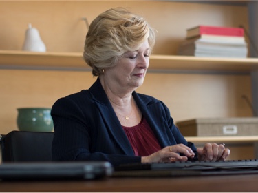 Woman typing at desk