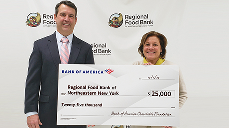 Bank of America employees presenting donation check