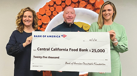 Bank of America employees presenting donation check