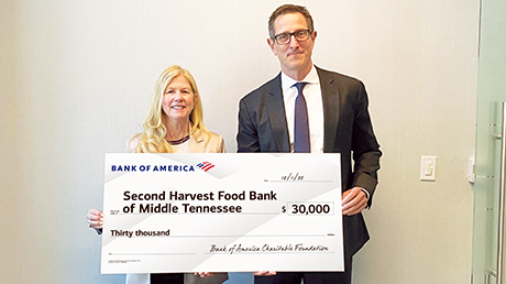Bank of America employees presenting donation check