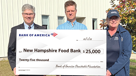 Bank of America employees presenting donation check