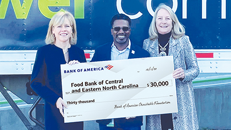 Bank of America employees presenting donation check