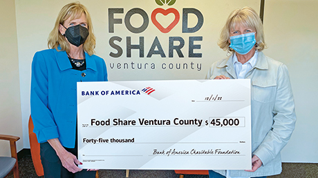 Bank of America employees presenting donation check
