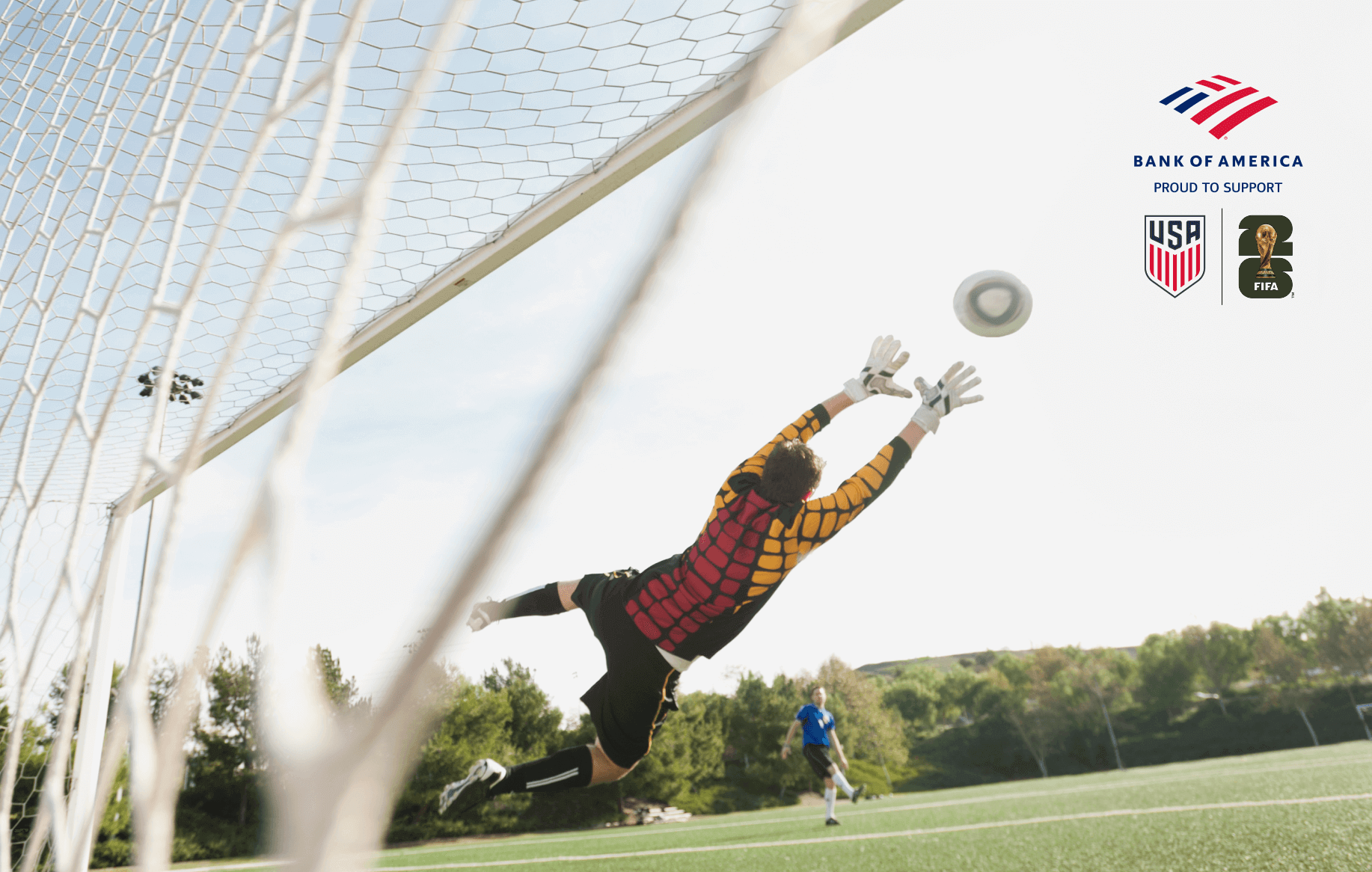 Soccer goalkeeper blocking a shot with outstretched arms