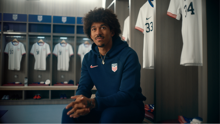 Chris Richards in U.S. Men’s National Team uniform sitting in locker room