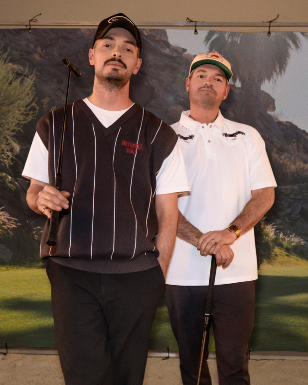 Brothers Will and Bert Brunner posing at a photoshoot wearing the clothing they designed for Devereux Golf.