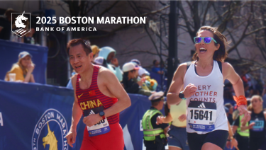 Two runners race with smiles on their faces