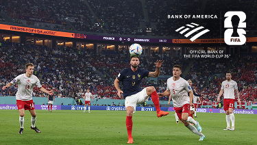 Olivier Giroud prepares to receive a pass surrounded by defenders from the Denmark National Soccer Team
