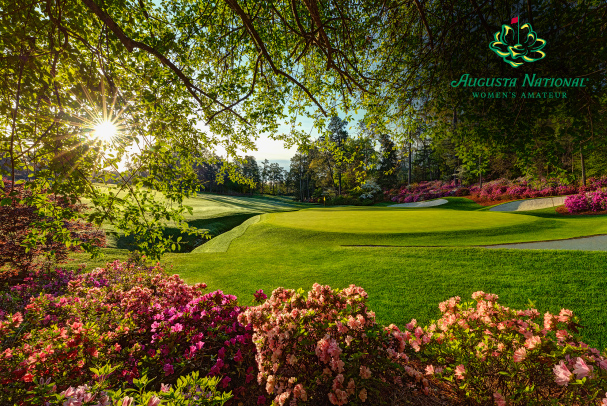 A manicured fairway and green stretch into the distance, bordered by trees and azaleas in full bloom. 