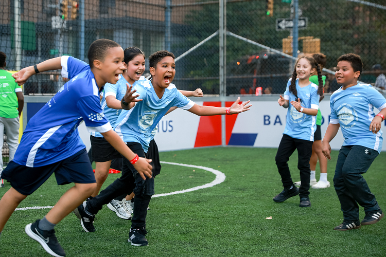 Kids playing in a soccer field
