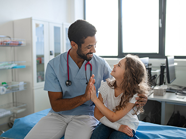 A doctor and patient high-fiving
