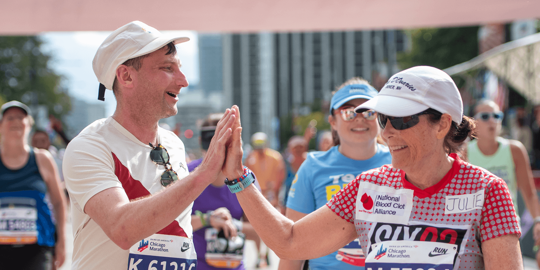 Two Chicago marathon runners celebrating with a high-five