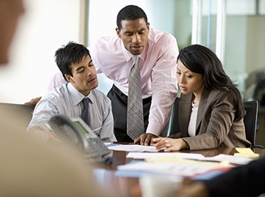 Three people working