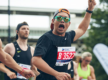 Man with fist in air, excitedly screaming