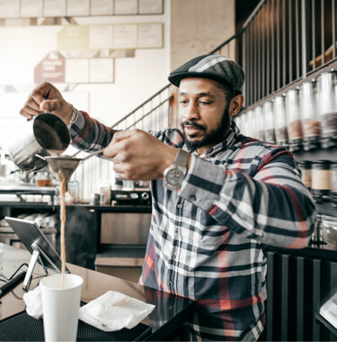 A man pouring coffee