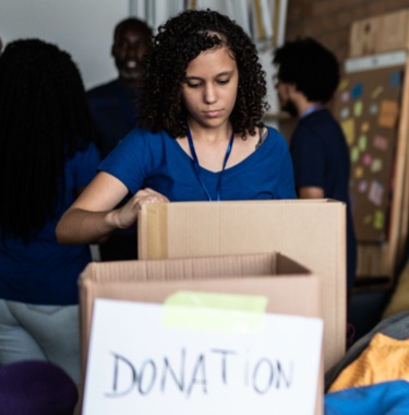 Volunteer organizing donations