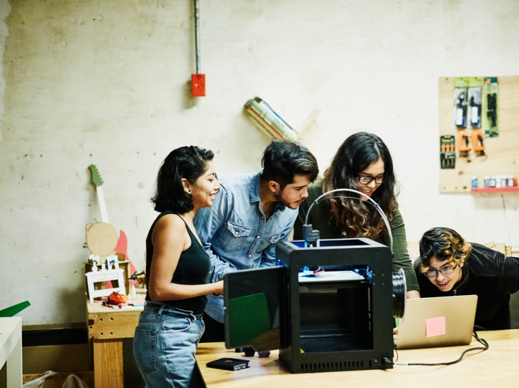 Four students in a workshop
