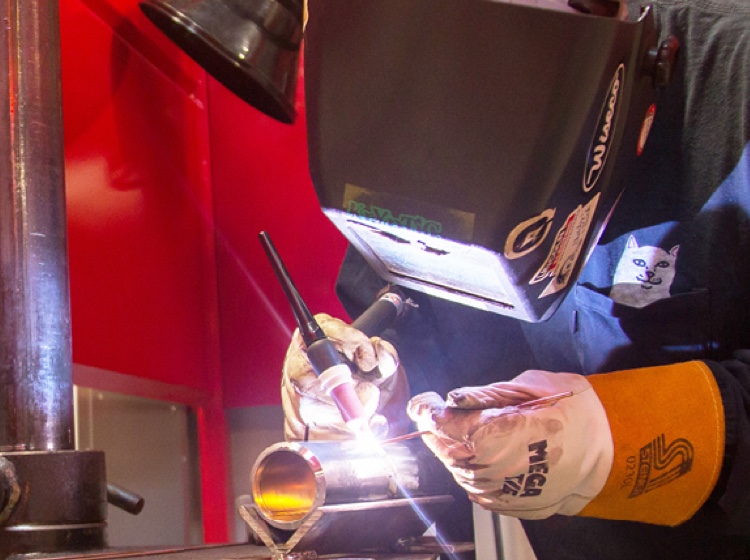 Welder working on a pipe